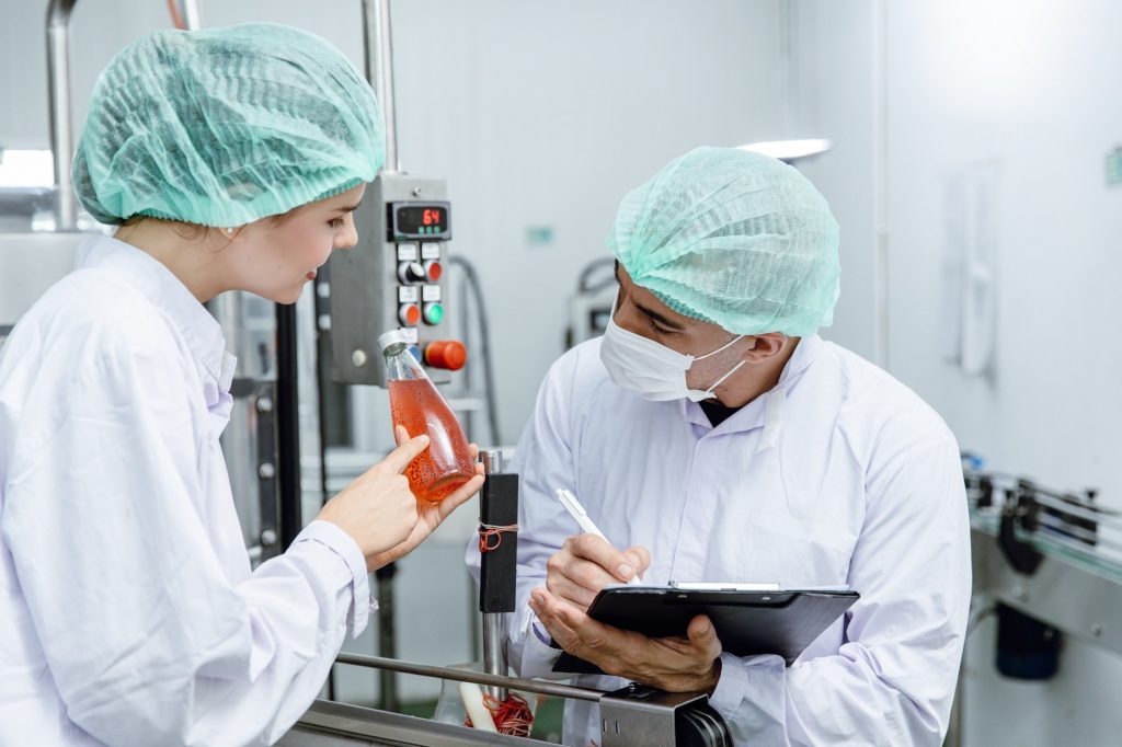 Quality control and food safety team inspection the product standard in the food and drink factory